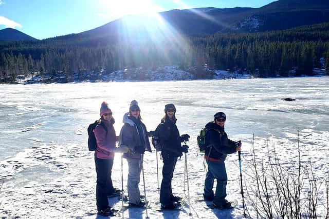 Ladies enjoy a snowshoeing tour at Sprague Lake in Rocky Mountain National Park.